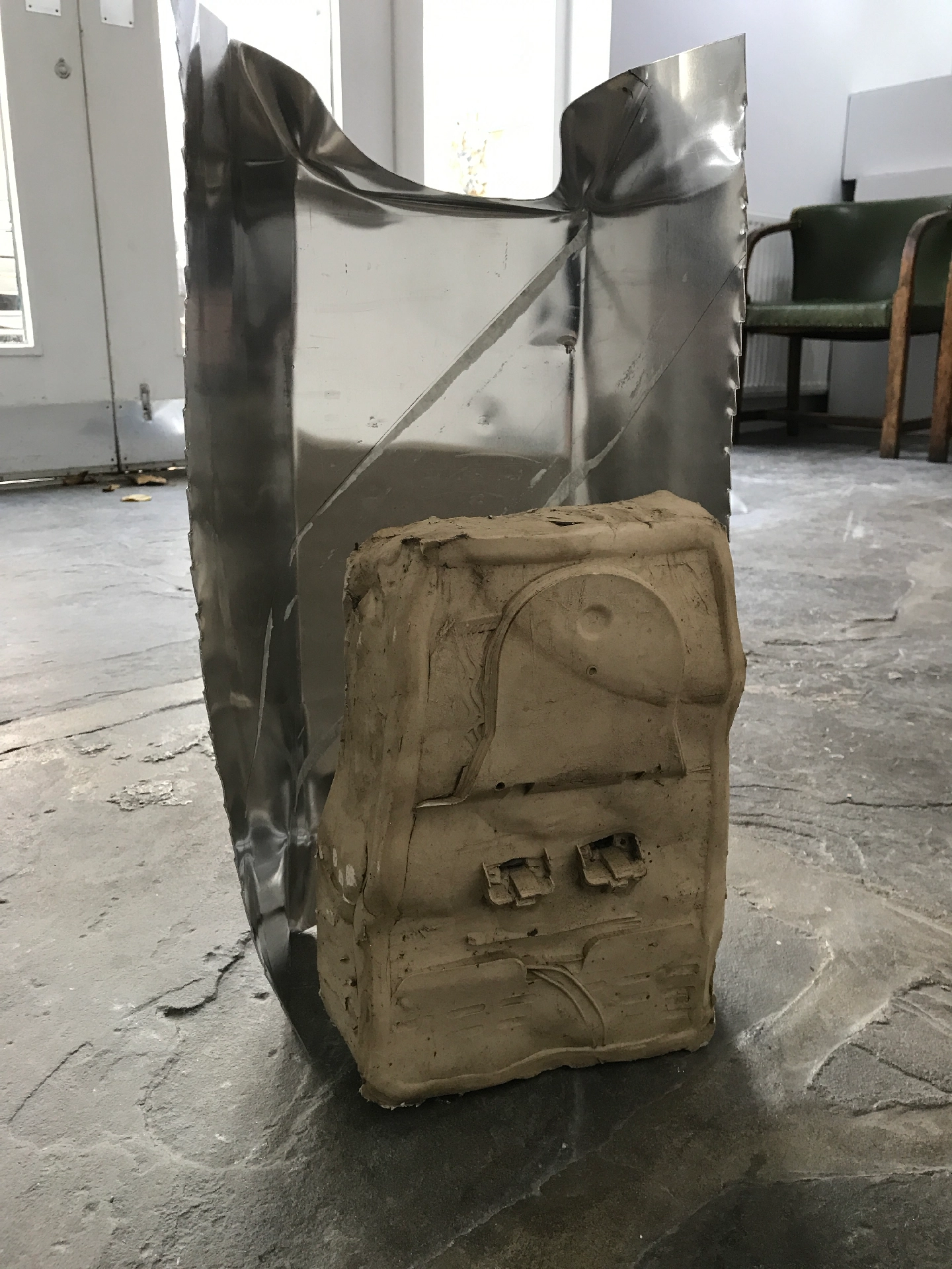 Aluminium sheet, plaster, dried clay