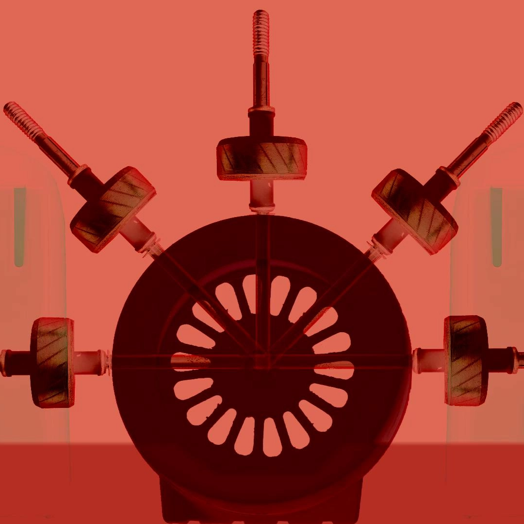 Screenshot from Eternal Engine, a red circular machine with pumps. There is two cyclindrical towers in the background flanking the machine