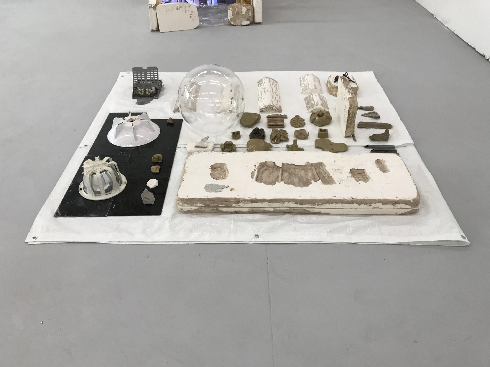 Tarpoulin, acrylic, found objects, plastic, glazed ceramic, plaster, unfired clay, 25mm steel square-tube, 3D printed SLS plastic