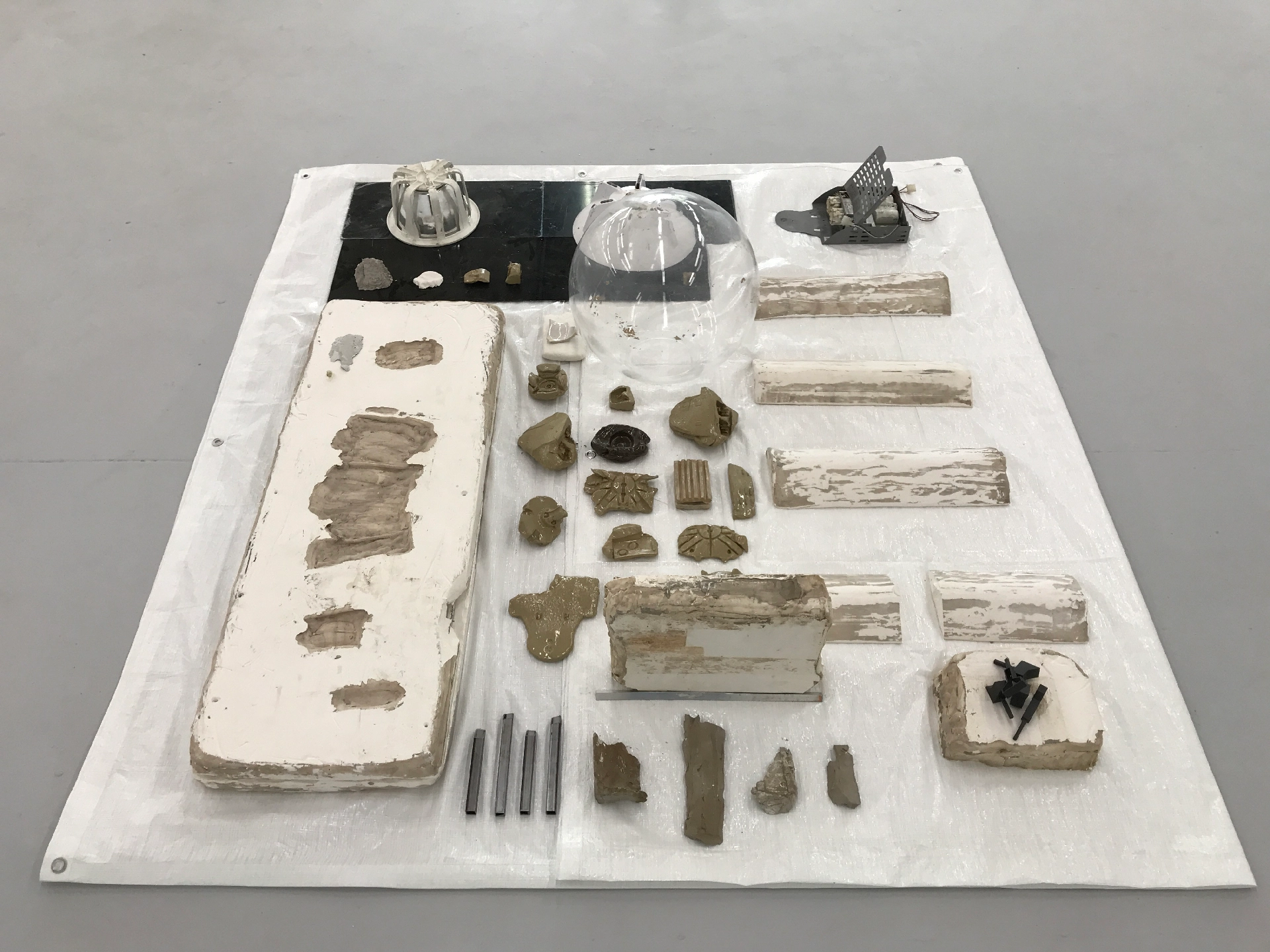Tarpoulin, acrylic, found objects, plastic, glazed ceramic, plaster, unfired clay, 25mm steel square-tube, 3D printed SLS plastic