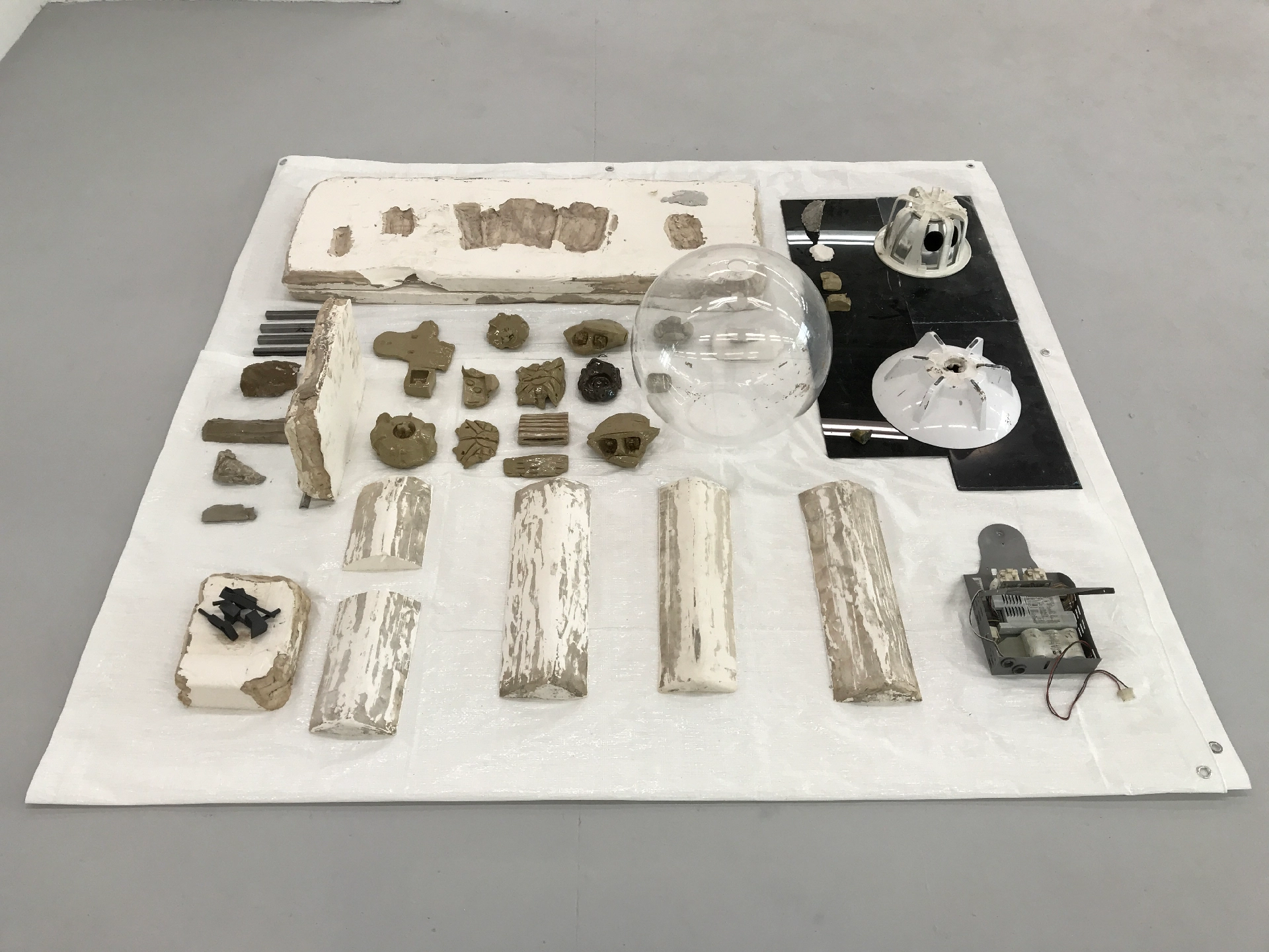 Tarpoulin, acrylic, found objects, plastic, glazed ceramic, plaster, unfired clay, 25mm steel square-tube, 3D printed SLS plastic