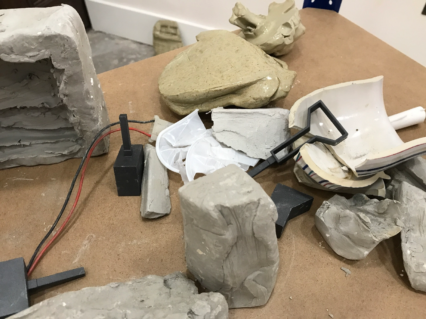 Glazed ceramic, unfired clay, 3D printed SLS plastic, shelving, found objects, plaster